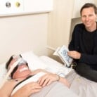 Man lying a bed with CPAP sleep mask