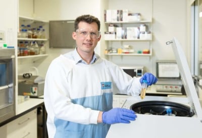 A male researcher in a lab testing samples