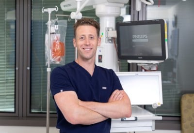 Dr Mark Plummer, smiling at camera, is leading an innovative trial into sepsis treatment.