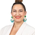 Woman smiling at camera for headshot photo