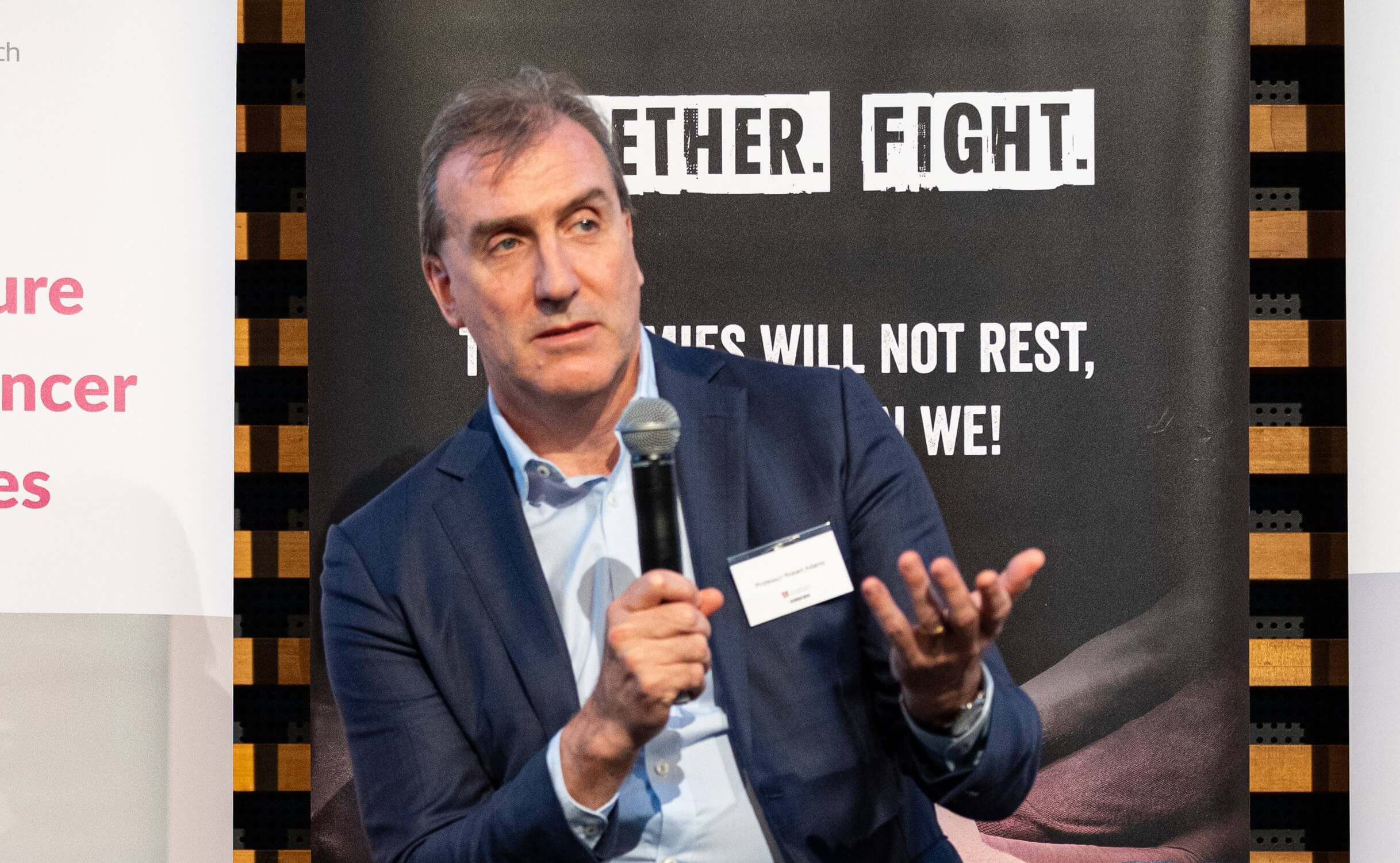 A man speaking into a microphone