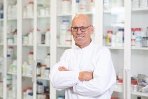 Prostate cancer researcher Professor Clive Prestige smiles at the camera in the lab