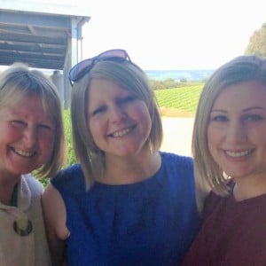 Michelle smiles with her mum Judith on her left and sister Jennifer on her right.