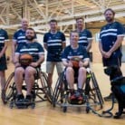 Athletes and wheelchair athletes on a basketball court