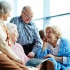 Older people smiling at each other