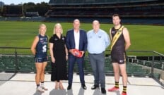 SANFL Darren Chandler with SANFL players and Paul Flynn and Briony Marshall