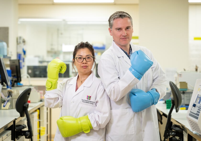 Hospital Research Foundation Group researchers in the lab with boxing gloves